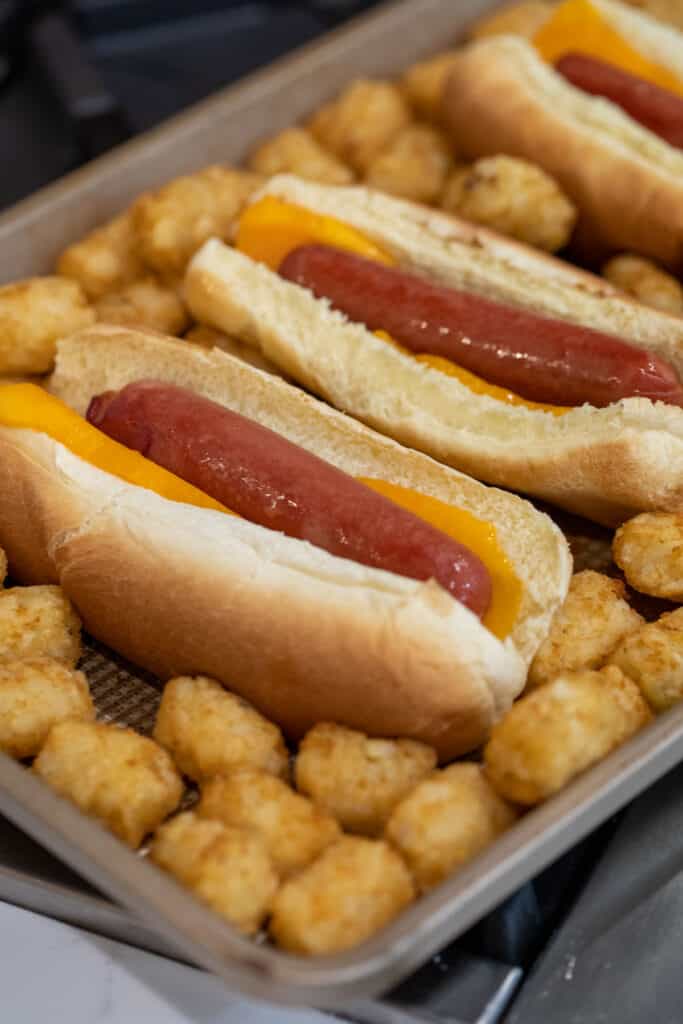 Hot dogs ready to be baked in the oven.