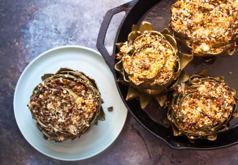 Stuffed Artichokes: These roasted artichokes are stuffed with a mix of delicious flavors like sun-dried tomatoes, feta, and basil. What a great appetizer! | macheesmo.com