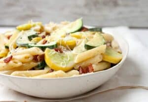 Summer Vegetable Carbonara: The perfect use for all that fresh summer squash and zucchini! This quick pasta dish is packed with sauteed veggies and tossed in a traditional carbonara sauce. It's so easy to make and done in about 30 minutes! Gotta love it! | macheesmo.com