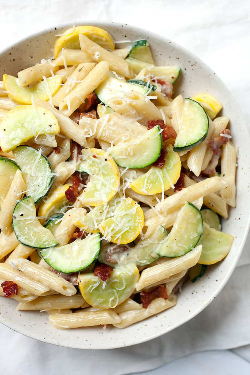 Summer Vegetable Carbonara: The perfect use for all that fresh summer squash and zucchini! This quick pasta dish is packed with sauteed veggies and tossed in a traditional carbonara sauce. It's so easy to make and done in about 30 minutes! Gotta love it! | macheesmo.com