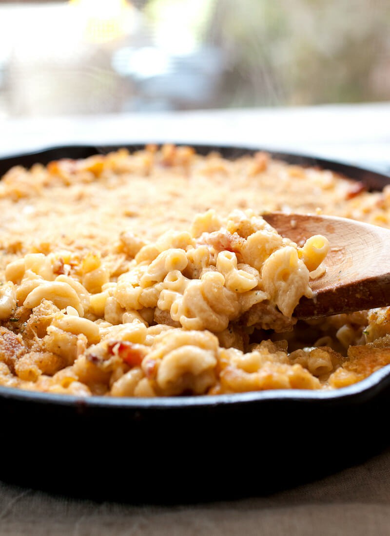 Cast Iron Mac and Cheese: A made-from-scratch mac and cheese with just enough bacon and spice, mixed together and baked in a cast iron skillet for crispy edges!