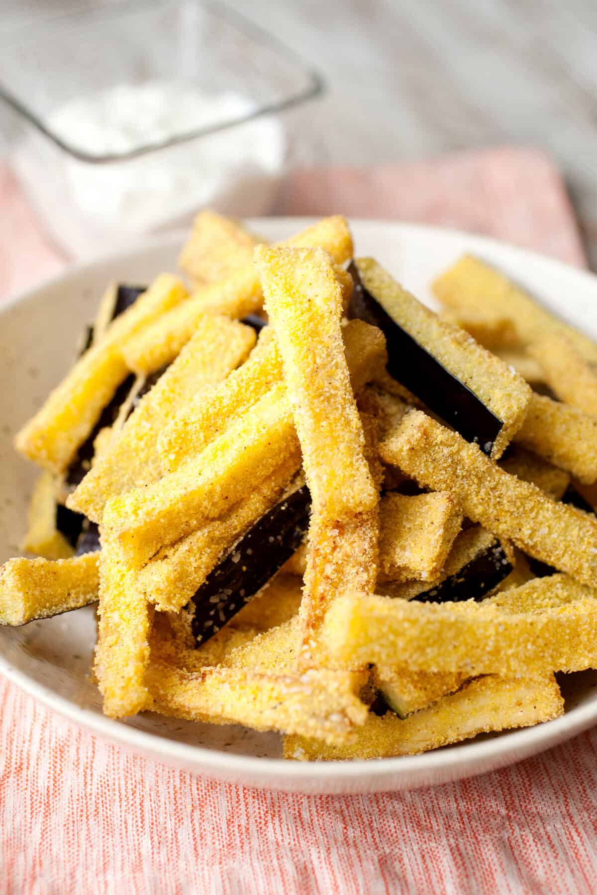Homemade Eggplant Fries: Crispy sticks of fried eggplant are one of my favorite side dishes. Relatively easy to make and perfect with a quick mint and yogurt dipping sauce! | macheesmo.com