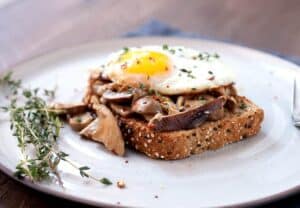 Creamed Mushrooms on Toast: One of my favorite simple breakfasts. Good hearty mushrooms, simply sauteed in olive oil with a few spices and simmered in a little cream. Piled onto sturdy toast with a few eggs! | macheesmo.com