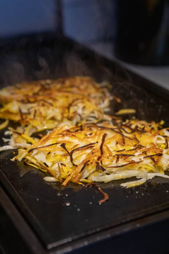 Cooking the squash hash on the griddle.