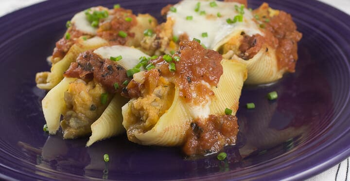 Sweet Potato Stuffed Shells - One of my favorite vegetarian stuffings for baked shells is a sweet potato mash. Add some cheese, tomato sauce, and chives and dinner is served!