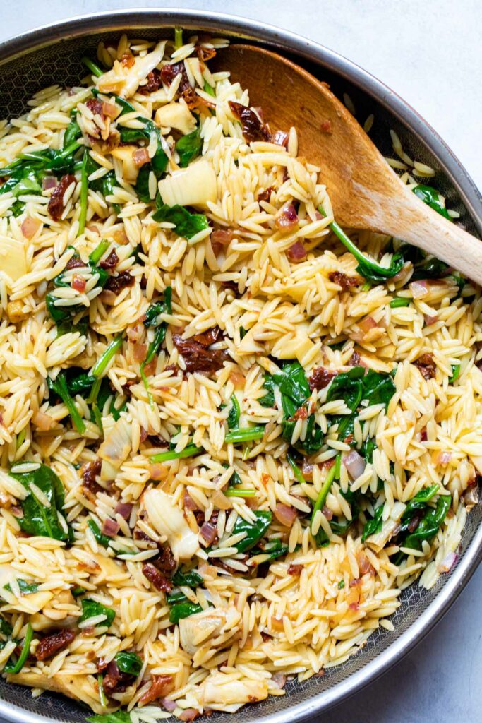 Orzo in the skillet.