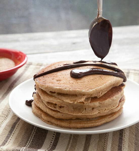 Churro pancakes with spicy chocolate sauce.