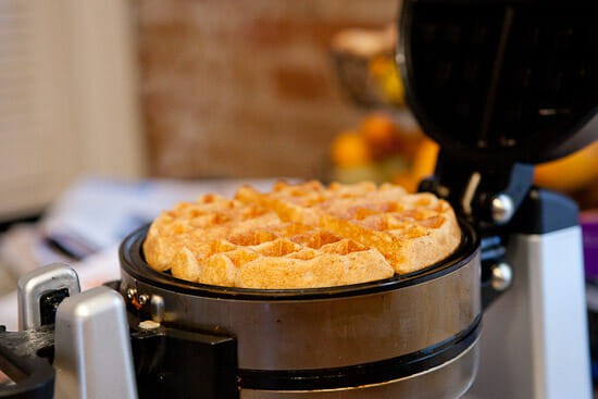 Cooking waffles for freezing.