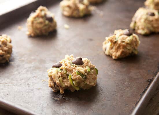 Zucchini chocolate chip cookies on a baking sheet.