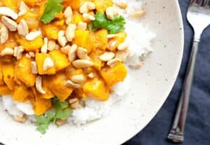 Pumpkin Curry Rice Bowls - Made from scratch with a real pumpkin! Don't get scared. It isn't that hard and is totally worth the work. Slightly spicy and sweet, this is the curry recipe you need in the fall!