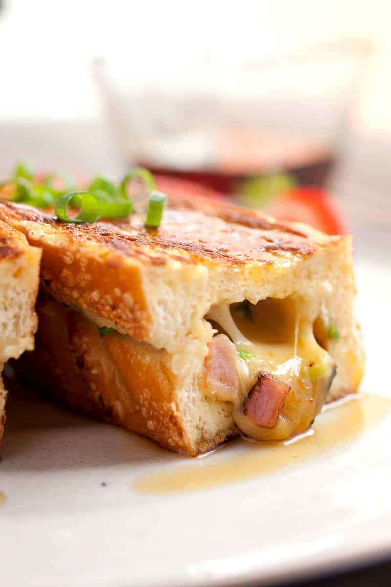 Savory Stuffed French Toast! This is the French toast of your dreams. The perfect mix of savory and sweet smashed together in thick pieces of French bread. So delicious and trust me when I say it's easier than it looks to make! | macheesmo.com