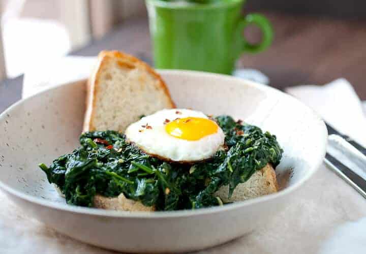 Creamed Spinach Breakfast Bowls: A simple, warming breakfast bowl. Slightly spicy creamed spinach (fresh spinach please!) simmered slowly and served over chunky bread with a crispy fried egg. Simple comfort food! | macheesmo.com