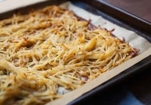 Sheet Pan Hash Browns: After much experimentation, this is the easiest and most failsafe way to make perfectly crispy (and flavorful) hash browns in the oven on a single sheet pan! You'll never stress over soggy potatoes again. | macheesmo.com
