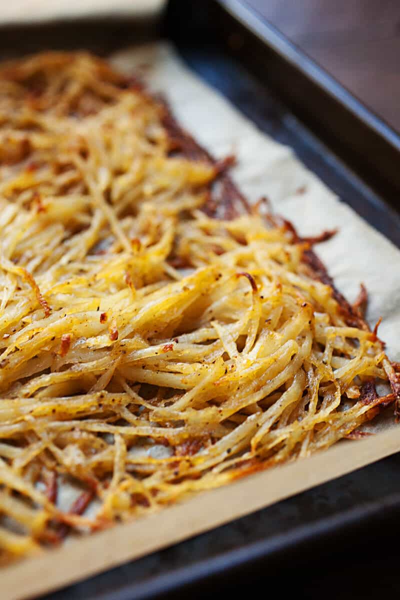Sheet Pan Hash Browns: After much experimentation, this is the easiest and most failsafe way to make perfectly crispy (and flavorful) hash browns in the oven on a single sheet pan! You'll never stress over soggy potatoes again. | macheesmo.com