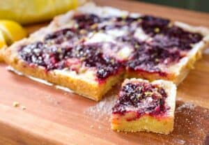 Lemon Cherry Swirl Bars: These simple baked dessert bars are gluten-free and use Bob's Red Mill Almond Flour for the crust! The bars are bright, fruity, tangy, and so very addictive. The recipe uses real lemons and cherries! #spons | macheesmo.com