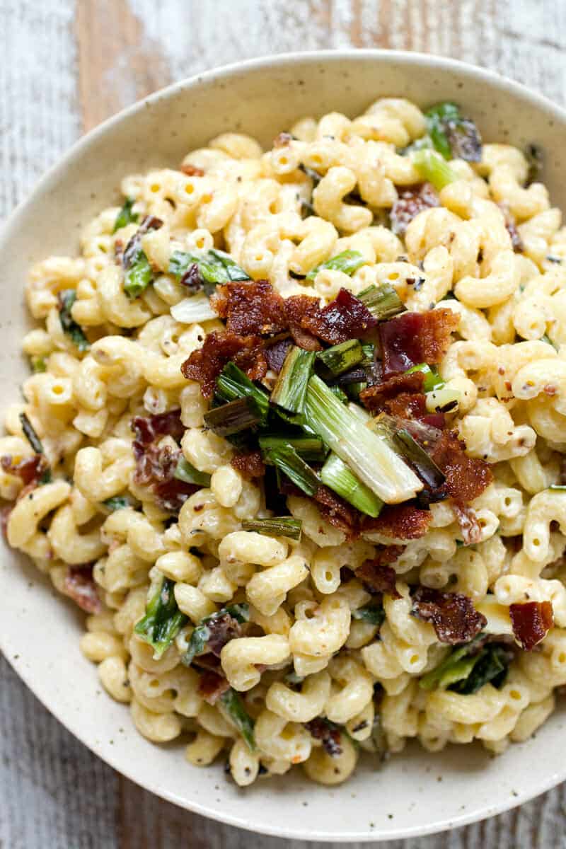 Charred Scallion and Bacon Macaroni Salad: Your new favorite macaroni salad, just in time for picnics and outside parties. Slightly sweet charred scallions, crispy bacon, and just enough dressing to hold it all together. Macaroni salad done right! | macheesmo.com