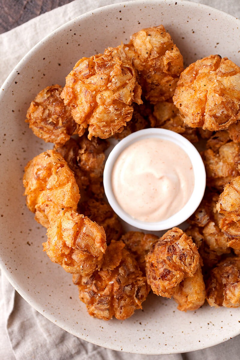 Bited Sized Blooming Onions: The perfect bite-sized version of the popular fried onion appetizer! Easy to share and easy to eat! So delicious and crispy with a soft slightly sweet and tangy bite. So good! | macheesmo.com