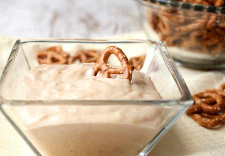 Peanut butter yogurt dip with pretzels is a delicious snack for your kids. It's just four ingredients and keeps in the fridge for a few days.