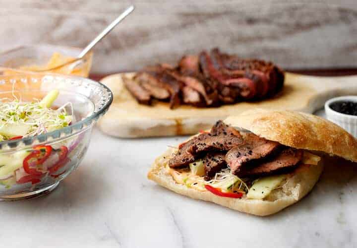 Korean Steak Sandwiches: Slighty spicy and sweet flank steak sliced thin and stuffed in a roll with spicy mayo and a crunchy veggie salad. One of the best steak sandwiches. Surprisingly light and refreshing! | macheesmo.com