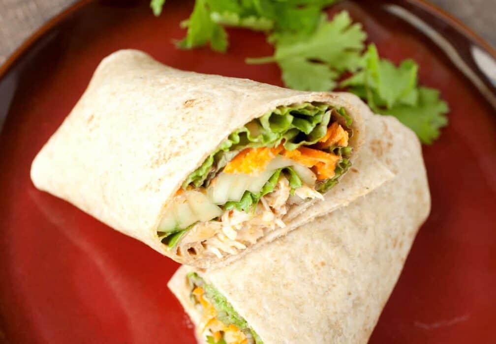 Spicy Coconut Chicken Wraps: These simple and flavorful chicken wraps can be made with poached chicken or a rotisserie chicken. They have loads of fresh, crunchy veggies but are still really fast to make. A great fast dinner or weekday lunch option! | macheesmo.com