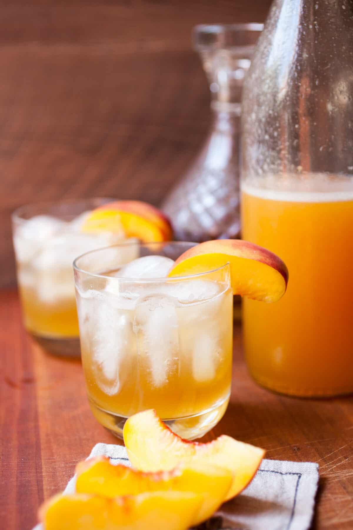 Easy Peach Cocktail Syrup: Just three ingredients (plus a pinch of salt) is all you need for this delicious seasonal cocktail syrup. I love it with a little gin or bourbon, but you can also make a delicious nonalcoholic beverage with club soda! Cheers! | macheesmo.com