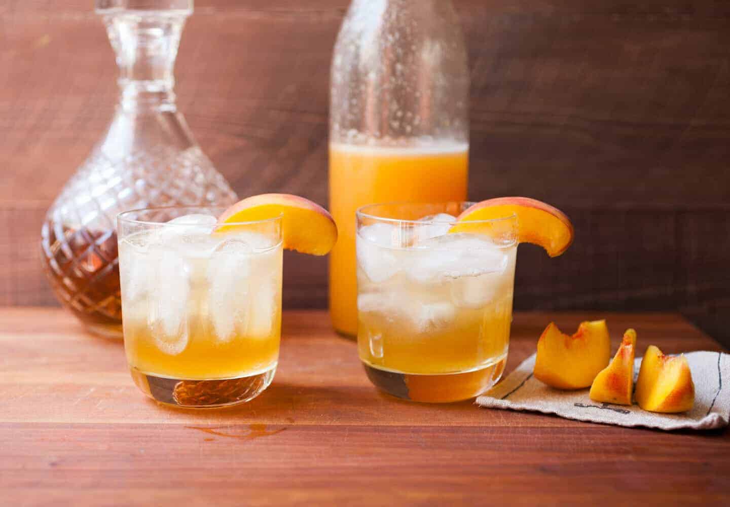 Easy Peach Cocktail Syrup: Just three ingredients (plus a pinch of salt) is all you need for this delicious seasonal cocktail syrup. I love it with a little gin or bourbon, but you can also make a delicious nonalcoholic beverage with club soda! Cheers! | macheesmo.com