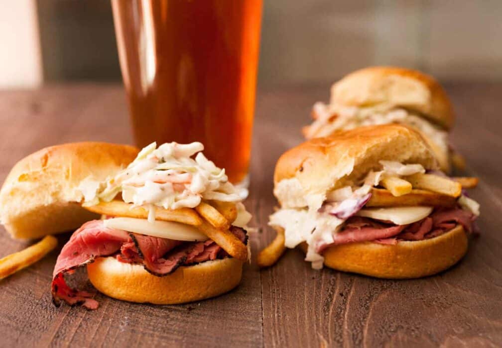 Primanti Style Sliders: Perfect game day snacks on mini slider buns. Made in the style of the classic Pittsburgh Primanti Bros sandwiches with crispy french fries IN the sandwich! So good! | macheesmo.com