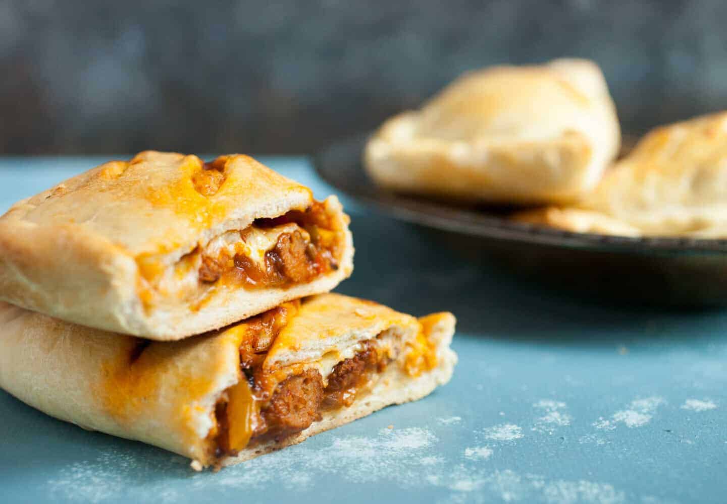 Sausage and Pepper Hot Pockets: These delicious homemade hot pockets are stuffed to the max with sausage, peppers, and cheese. They freeze perfectly as well and make for quick meals whenever you need one! | macheesmo.com