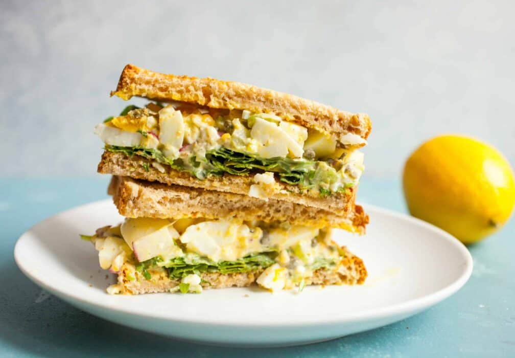 Lemon Caper Egg Salad: Egg salad can be so delicious if you make it right. This version is bright and crunchy with just enough dressing to keep it together. Serve it on white bread with some fresh arugula! | macheesmo.com