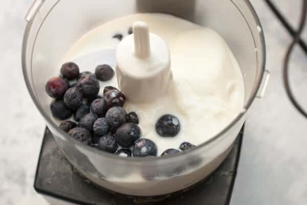 Blending blueberries and yogurt.