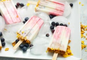 Fruit and Yogurt Breakfast Popsicles: These simple popsicles have just a few ingredients and are great way to beat the summer heat during breakfast! I like them as a healthy dessert option for my kiddos also! | macheesmo.com