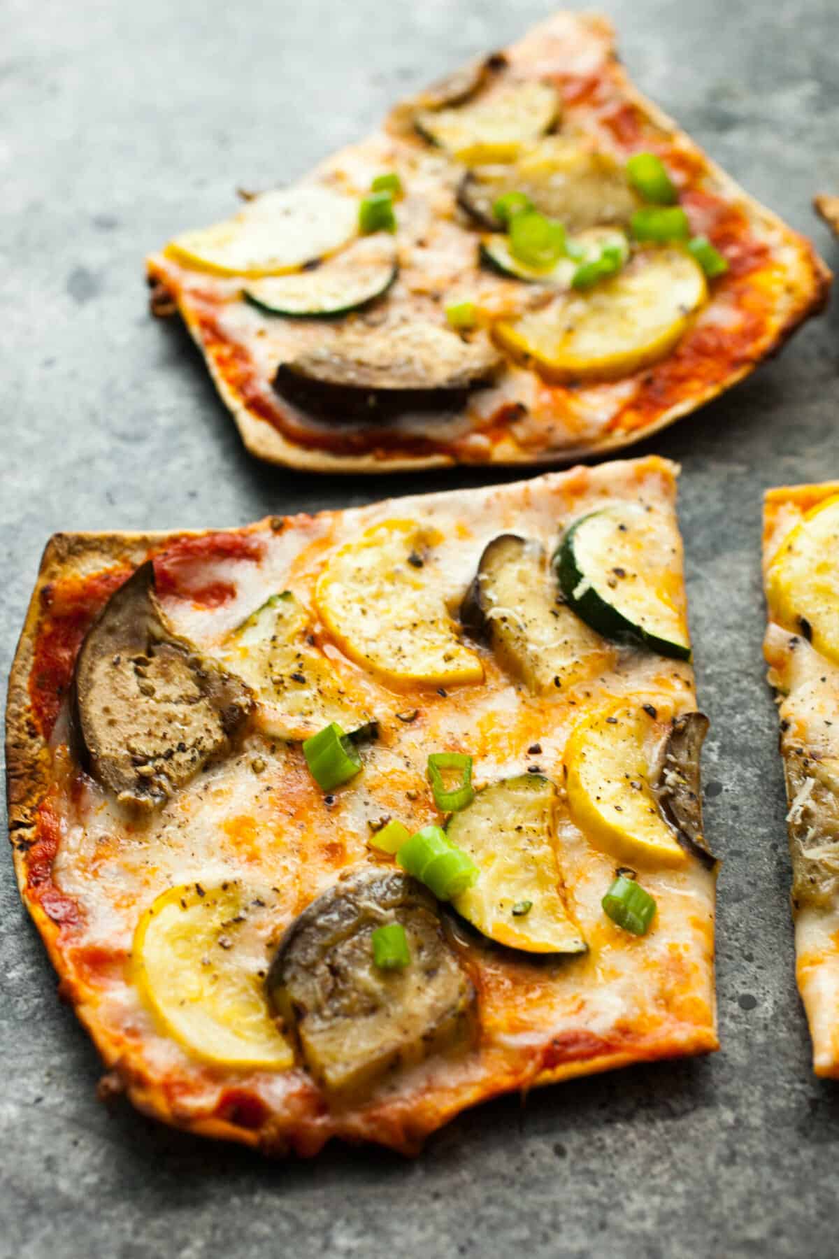 Grilled Ratatouille Pizza: This easy grilled pizza has a super-crispy crust and fresh ratatouille toppings (which are also grilled). Perfect for a summer cookout! | macheesmo.com