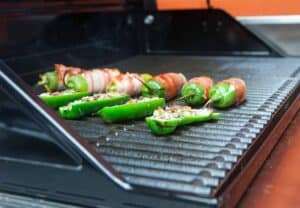 Three varieties of grilled jalapeno poppers.