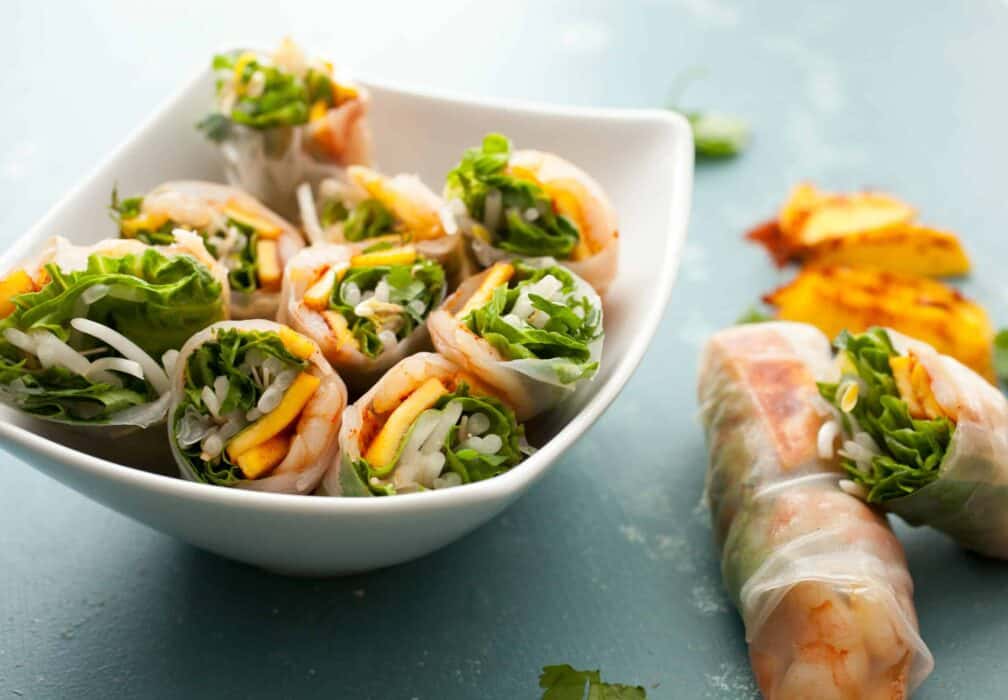 Chili Mango Shrimp Spring Rolls: These light and refreshing spring rolls are the perfect way to beat the summer heat. Serve them as a hearty appetizer or a lighter meal! | macheesmo.com