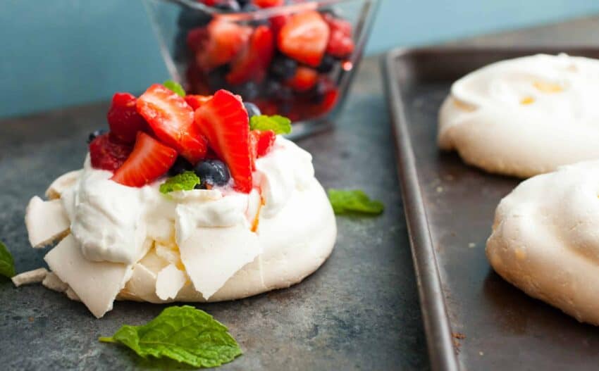 These mini pavlovas might just be the perfect dessert for a hot summer day. Light and refreshing and easy-to-make with a simple berry topping!