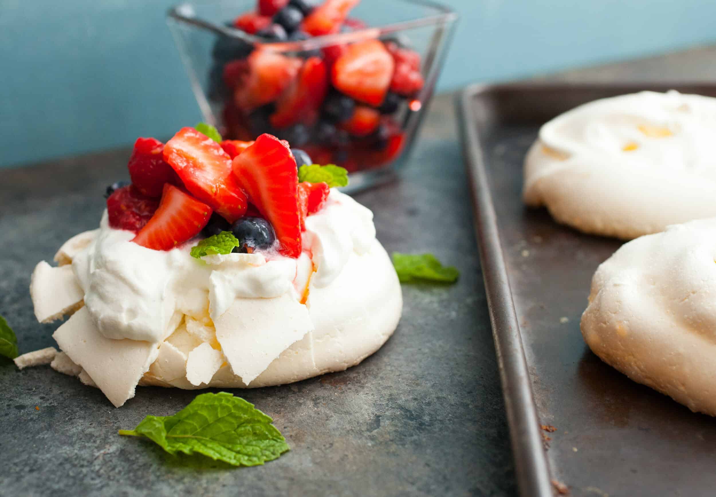 Triple Berry Mini Pavlovas: These might just be the perfect dessert for a hot summer day. Light and refreshing and just sweet enough. I like making them in mini form for easier serving also! | macheesmo.com