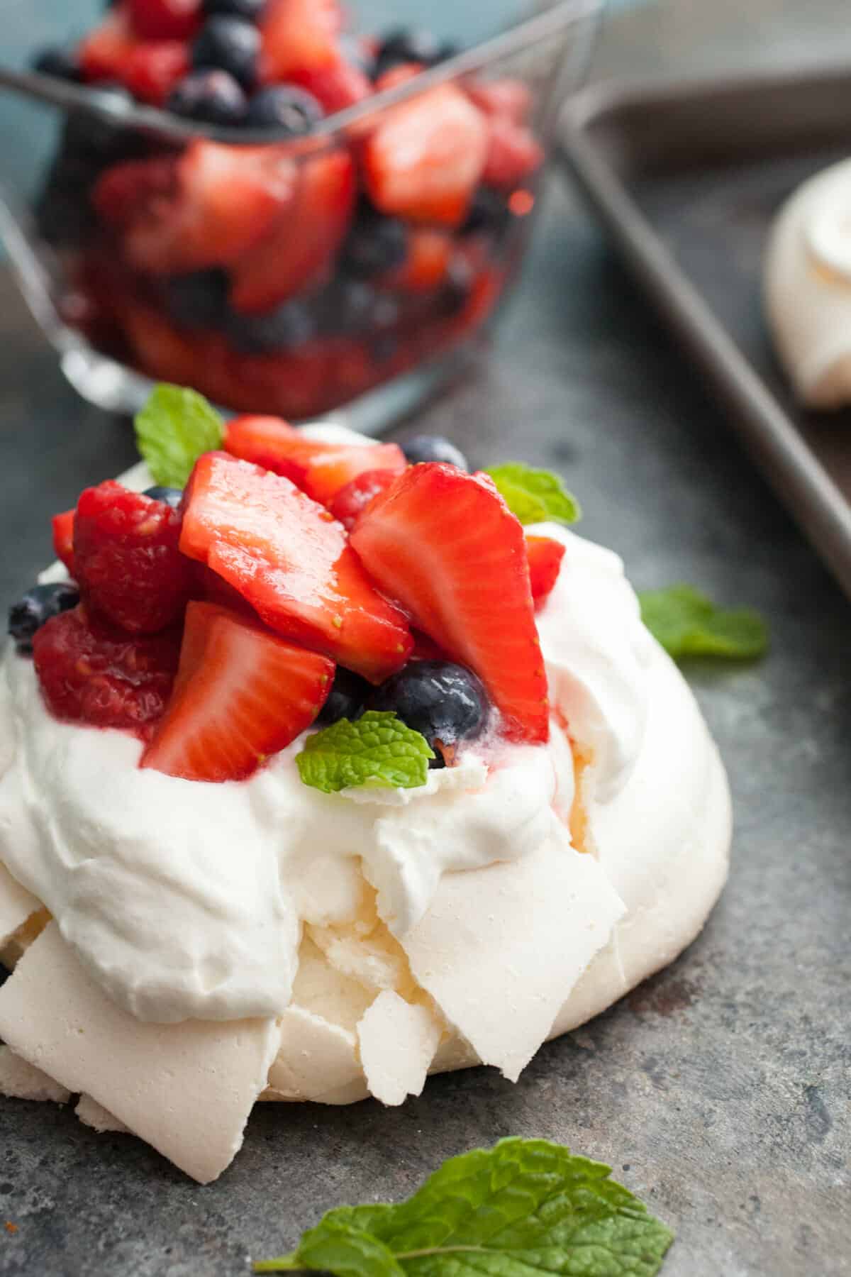 Triple Berry Mini Pavlovas: These might just be the perfect dessert for a hot summer day. Light and refreshing and just sweet enough. I like making them in mini form for easier serving also! | macheesmo.com