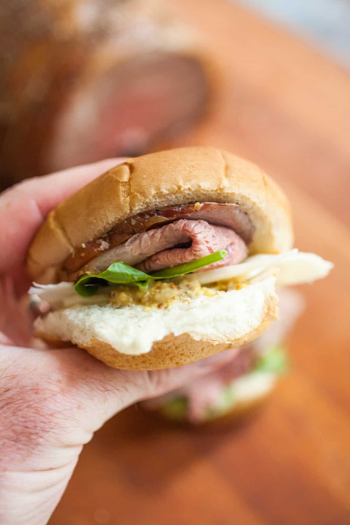 Roast Beef Sliders: The party food to beat all party foods! If you're feeding a crowd these roast beef sliders are much easier to make than you might think! Slice it thin and pile it high! | macheesmo.com