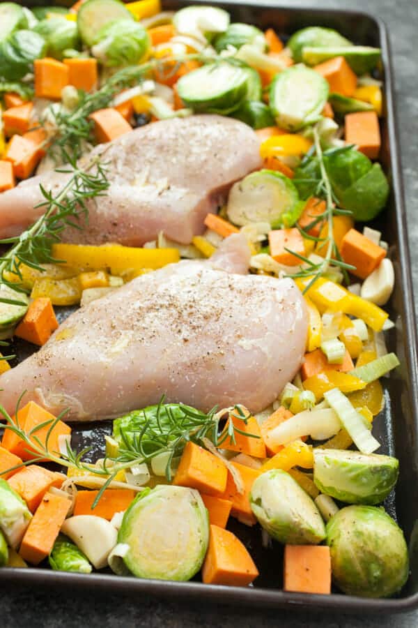 Chicken added to the sheet pan.