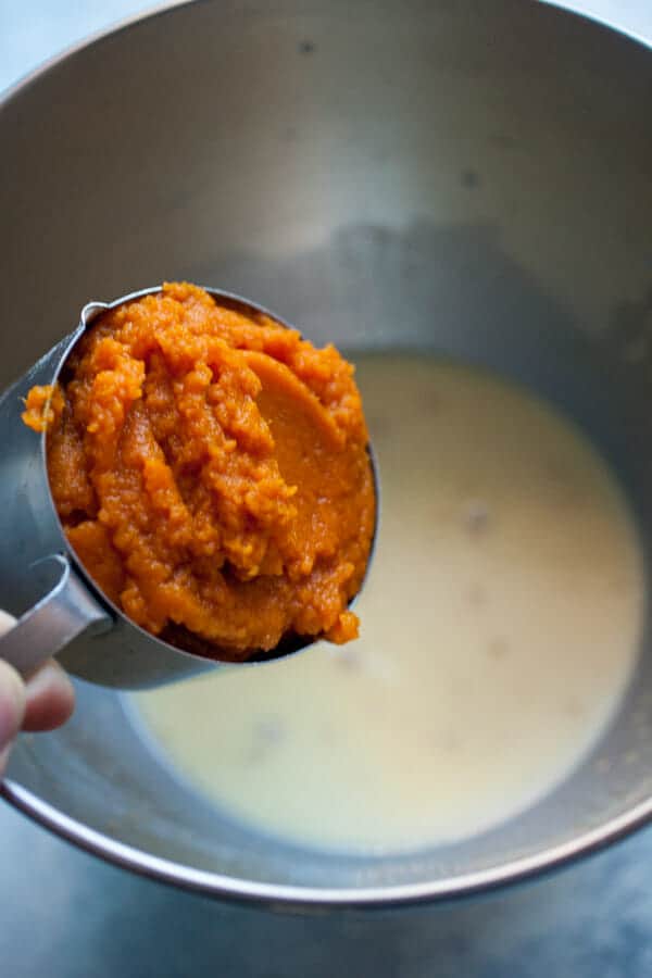Adding Pumpkin to dough.