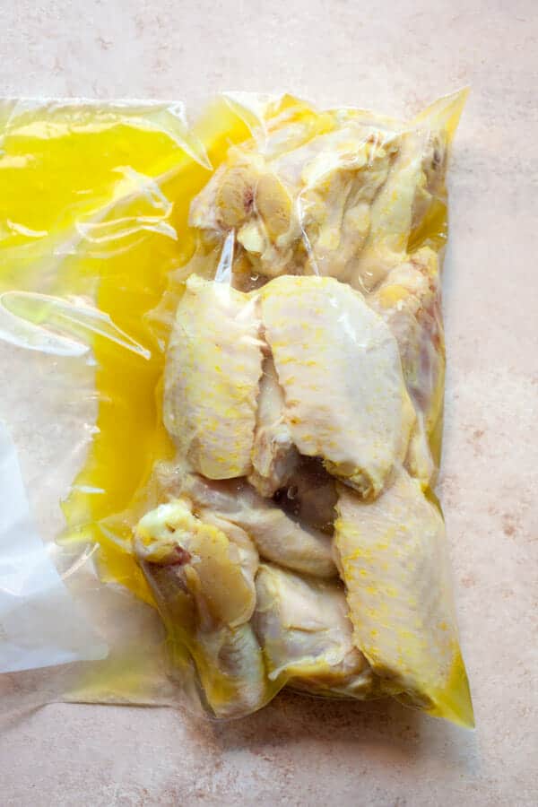 Adding Chicken wings to pickle brine.