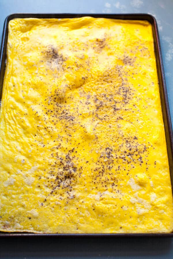 Eggs cooked in a sheet pan for Breakfast Sandwiches