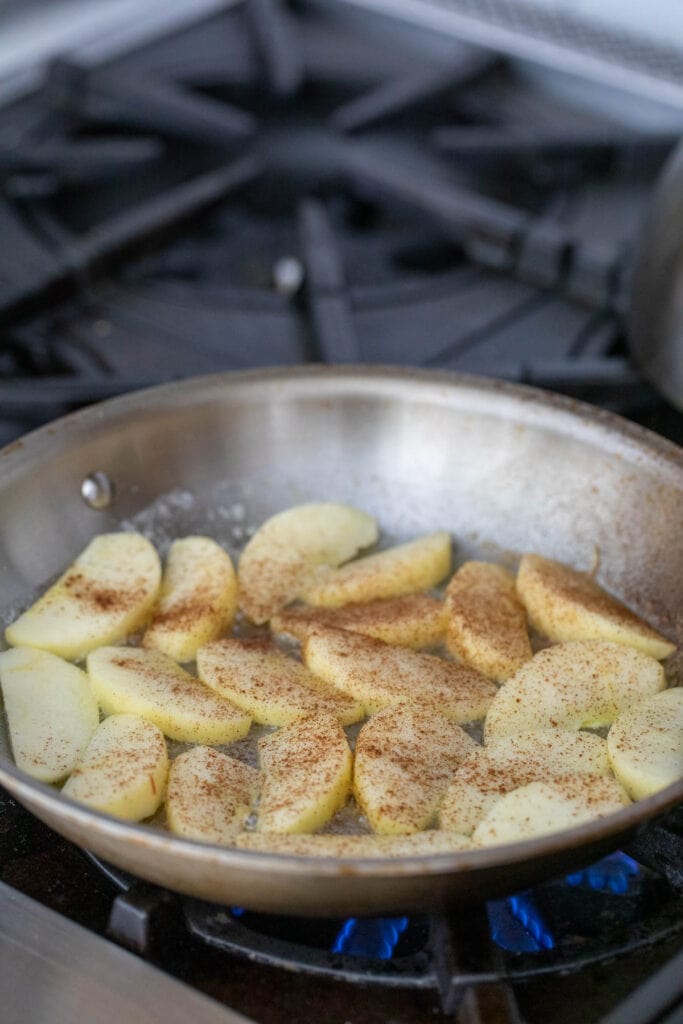 Cooking apple slices in a skillet