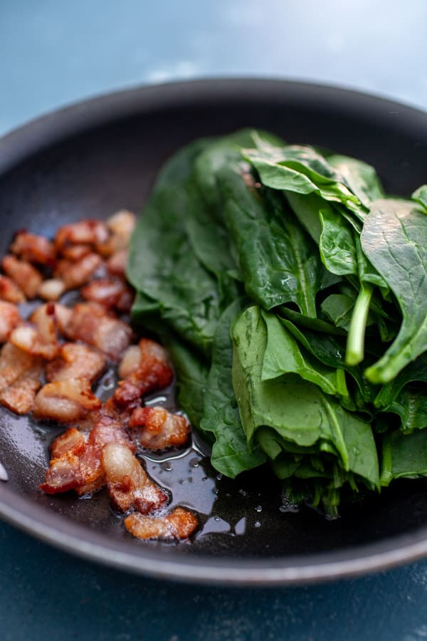 Cooking Bacon and spinach for omelette.