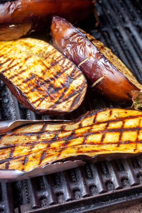 Charred eggplants on the grill