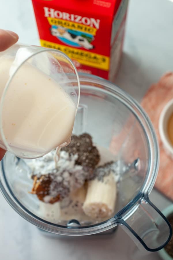 Adding milk - Creamy PB Banana Smoothies