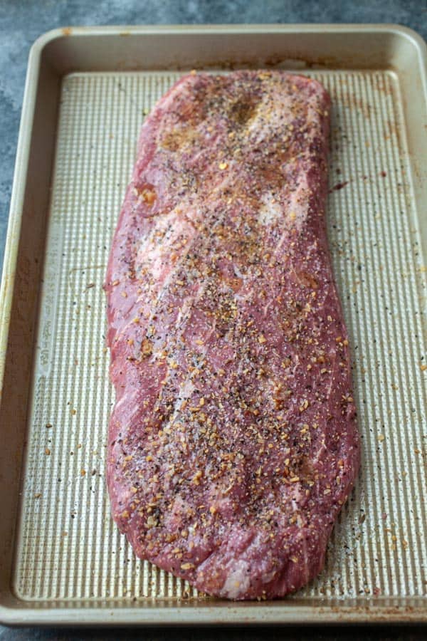Steak rubbed with seasoning to be grilled for ramen noodle salad. 