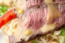 This delicious ramen noodle salad starts with simple noodles and topped with seared steak. It's the perfect example of a hearty and fast weeknight dinner.