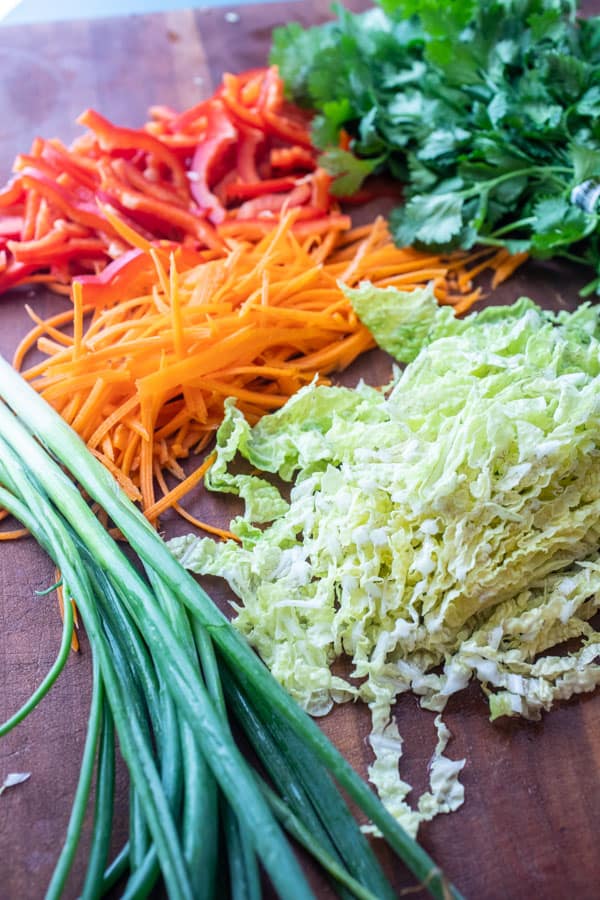 Veggies, cabbage, carrots, scallion and peppers for Thai noodle bowls.