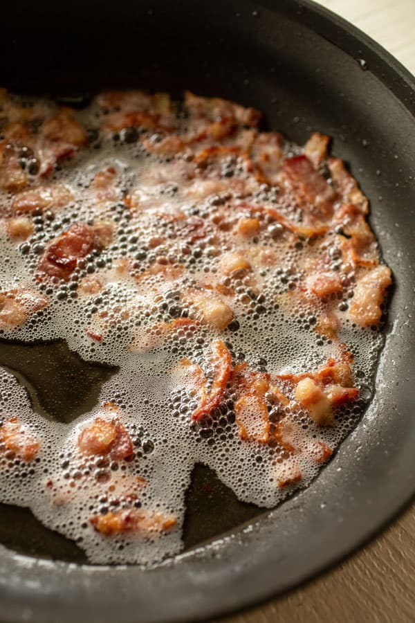 Bacon cooking in a skillet for breakfast casserole